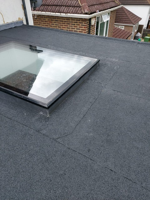 New flat roof and sky light installation