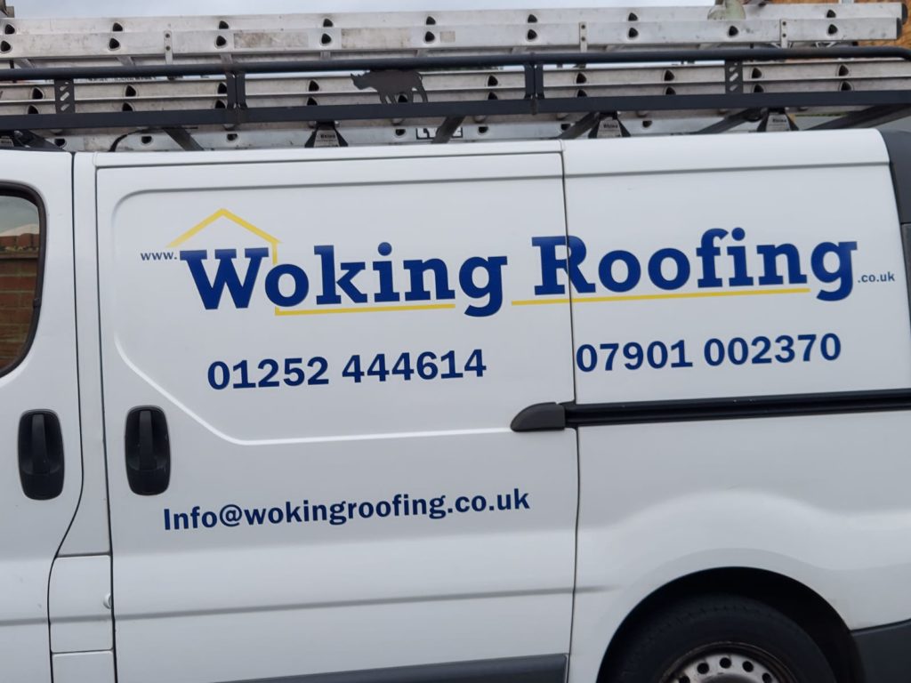 woking roofing van with signage